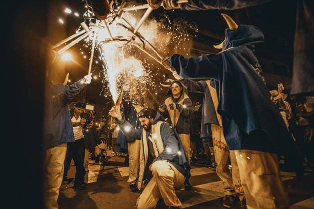 August 21, 2026, Barcelona, Catalonia, Spain: Fire runners gather to ignite their firework staffs beneath a shower of sparks during the traditional Ã¢â‚¬ËœCorrefocÃ¢â‚¬â ¢ at the Festa Major de Gracia Barcelona Spain - ZUMAo105 20260821_fap_o105_008 Copyright: xMatthiasxOesterlex