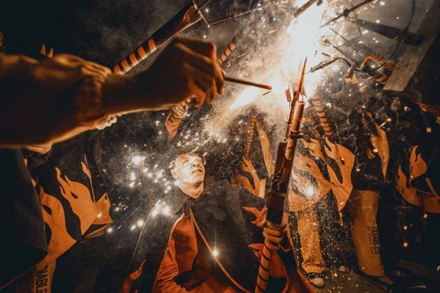 August 21, 2026, Barcelona, Catalonia, Spain: Fire runners gather to ignite their firework staffs beneath a shower of sparks during the traditional Ã¢â‚¬ËœCorrefocÃ¢â‚¬â ¢ at the Festa Major de Gracia Barcelona Spain - ZUMAo105 20260821_fap_o105_021 Copyright: xMatthiasxOesterlex