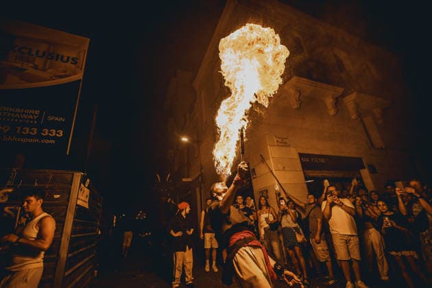 August 21, 2026, Barcelona, Catalonia, Spain: A fire breather blows a plume of fire during the traditional Ã¢â‚¬ËœCorrefocÃ¢â‚¬â ¢ at the Festa Major de Gracia Barcelona Spain - ZUMAo105 20260821_fap_o105_026 Copyright: xMatthiasxOesterlex