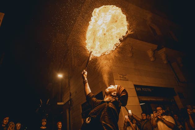 August 21, 2026, Barcelona, Catalonia, Spain: A fire breather blows a plume of fire during the traditional Ã¢â‚¬ËœCorrefocÃ¢â‚¬â ¢ at the Festa Major de Gracia Barcelona Spain - ZUMAo105 20260821_fap_o105_028 Copyright: xMatthiasxOesterlex