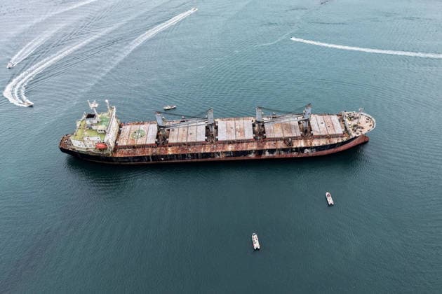 China Derelict Steel Attraction Sight-seeing boats sail around the deserted Panama-flagged cargo ship Blueways, which ran aground on a beach during a typhoon in September 2022, in Weihai, in eastern China s Shandong province, Friday, Aug. 21, 2026. The derelict steel hulk has since become a local tourist attraction., Credit:JASON ZHAO Utuku Feature China Avalon CHINA, SHANDONG, WEIHAI  Copyright: xJASONxZHAOx xUtuku FeaturexChinax xAvalonx 1127143335