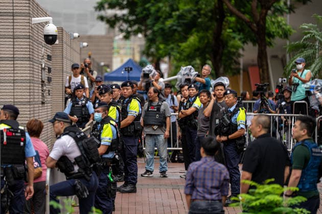 Hong Kong Court Verdit on Tiananmen Vigil Organizers Police officers standing guard outside the West Kowloon Magistrates Courts before the court hands down the verdict on the Tiananmen Vigil Organizers on August 20, 2026 in Hong Kong. A Hong Kong court today founded the organizers of the previous annual Tiananmen Vigil in Victoria Park guilty of inciting subversion. (Photo by Vernon Yuen Nexpher Images) HONG KONG