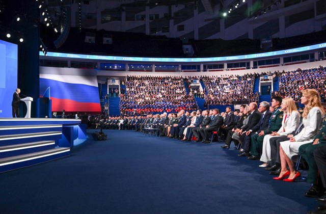 RUSSIA, MOSCOW - AUGUST 22, 2026: Russia s President Vladimir Putin (L) addresses a plenary session as part of Stage 2 of the United Russia Party s Congress ahead of the 2026 Russian State Duma election, at Megasport Sports Palace. Alexander Miridonov POOL TASS  96468819