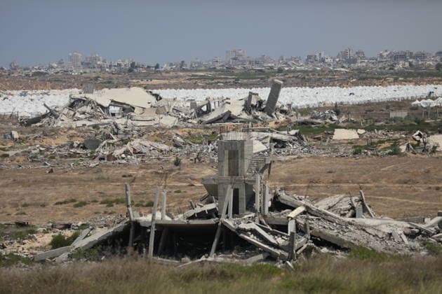 General View Shows War Damage in al-Mughraqa A general view shows the scale of destruction in residential areas in the al-Mughraqa area of the central Gaza Strip on August 22, 2026, as Palestinians move between the rubble of buildings destroyed during the war. Rubble and parts of collapsed buildings line both sides of the road, highlighting the widespread damage to the urban landscape and the daily life of residents. Photo by Hassan al-Jedi apaimages Nusairat Gaza Strip Palestinian Territory 220826_Mughraqa_HJ_00(14).jpeg Copyright: xapaimagesxHassanxal-Jedixx xapaimagesx