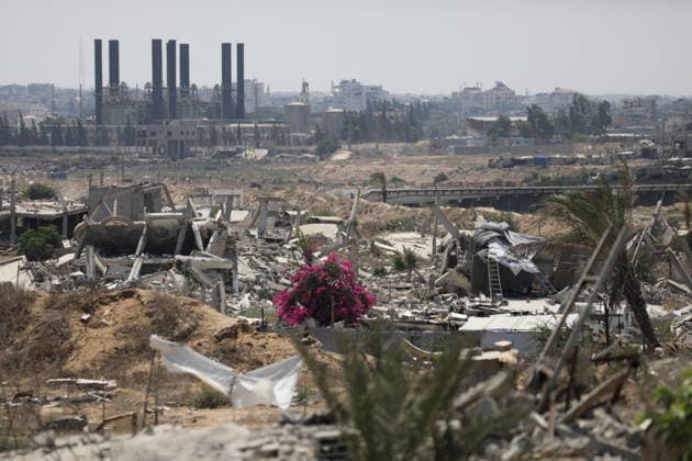 General View Shows War Damage in al-Mughraqa A general view shows the scale of destruction in residential areas in the al-Mughraqa area of the central Gaza Strip on August 22, 2026, as Palestinians move between the rubble of buildings destroyed during the war. Rubble and parts of collapsed buildings line both sides of the road, highlighting the widespread damage to the urban landscape and the daily life of residents. Photo by Hassan al-Jedi apaimages Nusairat Gaza Strip Palestinian Territory 220826_Mughraqa_HJ_00(30).jpeg Copyright: xapaimagesxHassanxal-Jedixx xapaimagesx