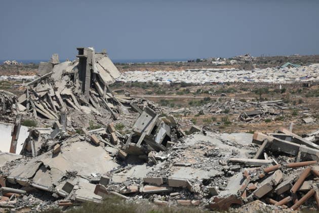 General View Shows War Damage in al-Mughraqa A general view shows the scale of destruction in residential areas in the al-Mughraqa area of the central Gaza Strip on August 22, 2026, as Palestinians move between the rubble of buildings destroyed during the war. Rubble and parts of collapsed buildings line both sides of the road, highlighting the widespread damage to the urban landscape and the daily life of residents. Photo by Hassan al-Jedi apaimages Nusairat Gaza Strip Palestinian Territory 220826_Mughraqa_HJ_00(12).jpeg Copyright: xapaimagesxHassanxal-Jedixx xapaimagesx
