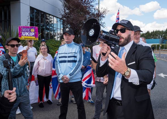 August 22, 2026, Gloucester, Gloucestershire, UK: Gloucester, UK. NICK TENCONI, leader of UKIP, speaks. A protest by a group called Gloucester Patriots at the Ibis Hotel in Bristol where asylum seekers and migrants are being accommodated. An anti-racist counter protest in support of refugees took place at the same location. Gloucester UK  - ZUMAl94_ 20260822_zaf_l94_009 Copyright: xSimonxChapmanx