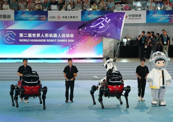 (260822) -- BEIJING, Aug. 22, 2026 -- A humanoid robot waves the flag of the World Humanoid Robot Games during the opening ceremony of the 2nd World Humanoid Robot Games in Beijing, capital of China, Aug. 22, 2026. ) (SP)CHINA-BEIJING-WORLD HUMANOID ROBOT GAMES-OPENING CEREMONY (CN) ZhangxChenlin 