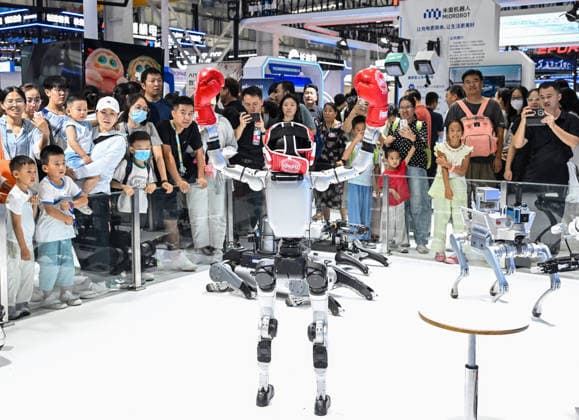 (260822) -- BEIJING, Aug. 22, 2026 -- People visit the 2026 World Robot Conference in Beijing, capital of China, Aug. 22, 2026. The conference, which runs from Wednesday through Sunday, has drawn more than 300 exhibitors from 26 countries, with over 3,000 products on display, including more than 300 debuts. Many people visited the conference on Saturday, the first open day of the event. ) CHINA-BEIJING-WORLD ROBOT CONFERENCE (CN) ChenxYehua 