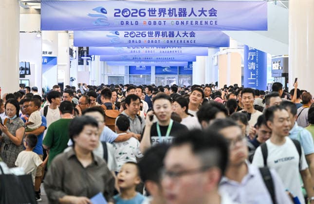(260822) -- BEIJING, Aug. 22, 2026 -- People visit the 2026 World Robot Conference in Beijing, capital of China, Aug. 22, 2026. The conference, which runs from Wednesday through Sunday, has drawn more than 300 exhibitors from 26 countries, with over 3,000 products on display, including more than 300 debuts. Many people visited the conference on Saturday, the first open day of the event. ) CHINA-BEIJING-WORLD ROBOT CONFERENCE (CN) ChenxYehua 