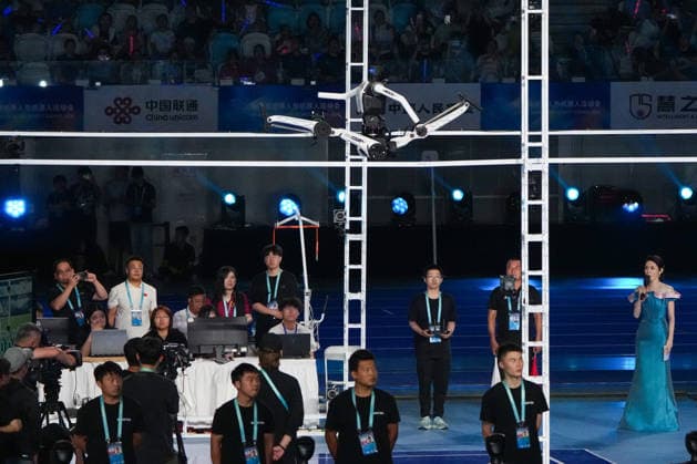 (260822) -- BEIJING, Aug. 22, 2026 -- A humanoid robot takes part in a high jump competition during the opening ceremony of the 2nd World Humanoid Robot Games in Beijing, capital of China, Aug. 22, 2026. ) (SP)CHINA-BEIJING-WORLD HUMANOID ROBOT GAMES-OPENING CEREMONY (CN) JuxHuanzong 