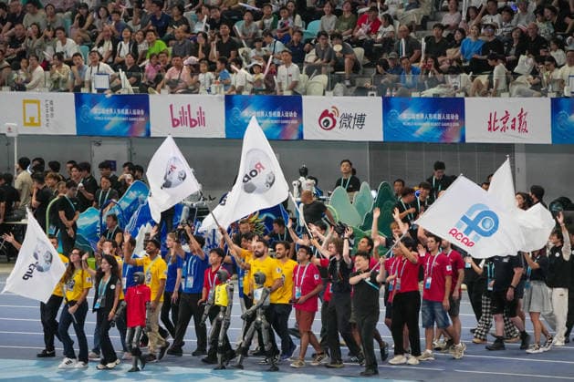 (260822) -- BEIJING, Aug. 22, 2026 -- Delegations parade during the opening ceremony of the 2nd World Humanoid Robot Games in Beijing, capital of China, Aug. 22, 2026. ) (SP)CHINA-BEIJING-WORLD HUMANOID ROBOT GAMES-OPENING CEREMONY (CN) JuxHuanzong 
