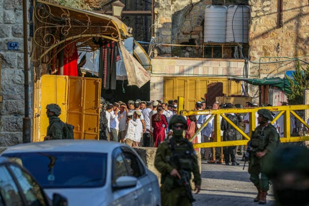 Israelis raid Hebron under Israeli forces protection HEBRON, WEST BANK, PALESTINE - AUGUST 22: Israelis raid the Old City area of the city of Hebron, West Bank, Palestine under the protection of Israeli forces on August 22, 2026. Israeli forces restricted Palestinians movement in the area by blocking entrances and exits with iron barriers. Wisam Hashlamoun Anadolu Hebron West Bank. Editorial use only. Please get in touch for any other usage.  Copyright: x2026xAnadoluxWisamxHashlamounx