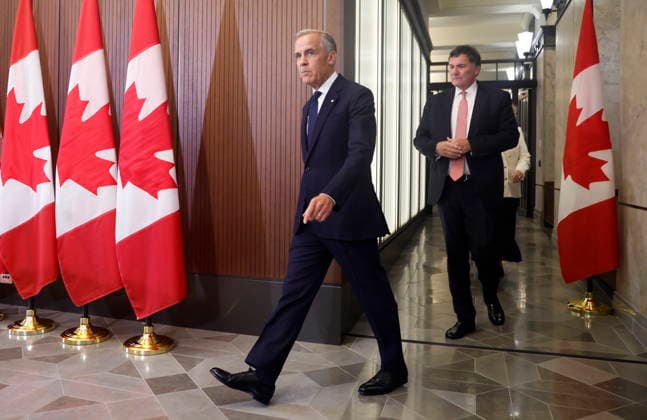 August 22, 2026, Ottawa, On, CANADA: Prime Minister Mark Carney and Canada-U.S. Trade Minister Dominic LeBlanc arrive at a news conference about Canada s response to new U.S. tariffs on Parliament Hill in Ottawa on Saturday, Aug. 22, 2026. Ottawa CANADA  - ZUMAc35_ 20260822_zaf_c35_014 Copyright: xPatrickxDoylex