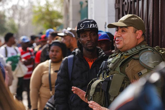 Santiago, August 22, 2026 The Haitian Embassy in Santiago is stormed by Haitian citizens due to issues with embassy staff and excessive fees for the paperwork required to work in Chile. Christian Monsalve, Aton Chile, Aton 1182688 jpeg  Copyright: CHRISTIANxMONSALVE ATONxCHILE