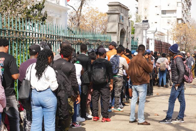 Santiago, August 22, 2026 The Haitian Embassy in Santiago is stormed by Haitian citizens due to issues with embassy staff and excessive fees for the paperwork required to work in Chile. Christian Monsalve Aton Chile, Aton 1182690 jpeg  Copyright: CHRISTIANxMONSALVE ATONxCHILE
