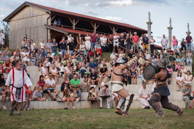 (260822) -- PTUJ, Aug. 22, 2026 -- Participants dressed in gladiators demonstrate their battle skills during the Roman Games Festival in Ptuj, Slovenia, Aug. 22, 2026. The 19th edition of the Roman Games festival kicked off on Friday in Ptuj and will last till Aug. 23. (Photo by Xinhua) SLOVENIA-PTUJ-ROMAN GAMES FESTIVAL ZeljkoxStevanic 