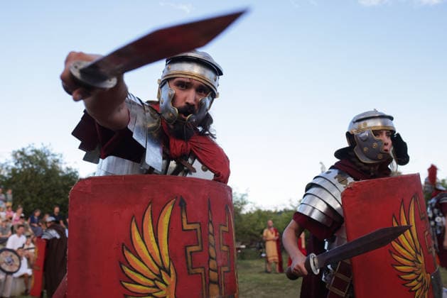 (260822) -- PTUJ, Aug. 22, 2026 -- Participants dressed as Roman soldiers present military skills during the Roman Games Festival in Ptuj, Slovenia, Aug. 22, 2026. The 19th edition of the Roman Games festival kicked off on Friday in Ptuj and will last till Aug. 23. (Photo by Xinhua) SLOVENIA-PTUJ-ROMAN GAMES FESTIVAL ZeljkoxStevanic 