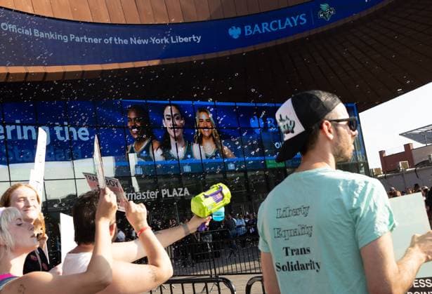Protest Scenes outside Barclay Center for Indiana Fever vs NY Liberty WNBA Protest Scenes outside Barclay Center for Indiana Fever vs NY Liberty WNBA, Pro Trans Activists and Sophie Cunningham Supporters came out for the Liberty vs Fever Game. There is a huge controversy over men playing in women s sports. Sophie Cunningham of the Fever has been very vocal about the topic. , Barclay Center, NY. 22 Aug 2026 Pictured: Protestors Outside Fever vs Liberty Game at Barclay Center.  Copyright: xThexMegaxAgencyxMayerx xMEGAx