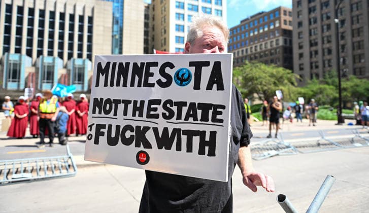 August 22, 2026, Minneapolis, Minnesota, USA: A protestor holds a sign up in response to far-right influencer Jake Lang coming through the city on Saturday, August 22nd, 2026 Minneapolis USA - ZUMAd171 20260822_znp_d171_001 Copyright: xSethxDonovanx