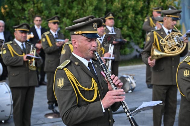 National Flag Day of Ukraine in Lviv LVIV, UKRAINE - AUGUST 23: A member of a Ukrainian military orchestra performs during a National Flag Day ceremony in Lviv, Ukraine, on August 23, 2026. Due to the ongoing Russian-Ukrainian War, celebrations were limited to a ceremonial raising of the Ukrainian flag on the city s highest flagpole with the participation of soldiers from various branches of the armed forces. Participants also observed a minute of silence for those killed, sang the Ukrainian national anthem, and listened to patriotic and folk songs performed by a military orchestra. Michael Sorrow Anadolu Lviv Ukraine. Editorial use only. Please get in touch for any other usage.  Copyright: x2026xAnadoluxMichaelxSorrowx
