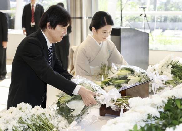 Japan crown prince, crown princess in Paraguay Japan s Crown Prince Fumihito and Crown Princess Kiko lay flowers during a ceremony marking 90 years of Japanese immigration to Paraguay on Aug. 21, 2026, near Asuncion. (Pool photo)  A14AA0005626457P
