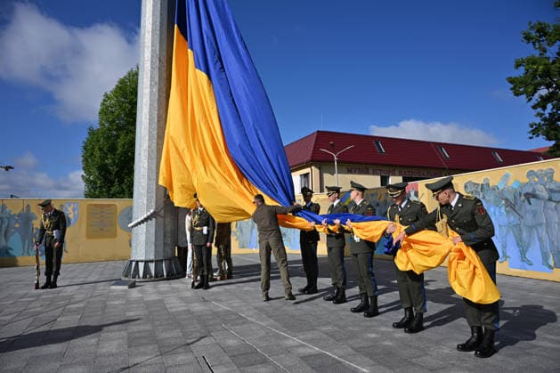 National Flag Day of Ukraine in Lviv LVIV, UKRAINE - AUGUST 23: Celebration of the National Flag Day of Ukraine during the Russian-Ukrainian War in Lviv, Ukraine on August 23, 2026. Due to the war, only the ceremonial raising of the Ukrainian flag on the highest flagpole in the city with the participation of soldiers from various branches of the armed forces took place. People also honored the fallen with a minute of silence, sang the Ukrainian anthem, and a military orchestra played several patriotic and folk songs. Michael Sorrow Anadolu Lviv Ukraine. Editorial use only. Please get in touch for any other usage.  Copyright: x2026xAnadoluxMichaelxSorrowx