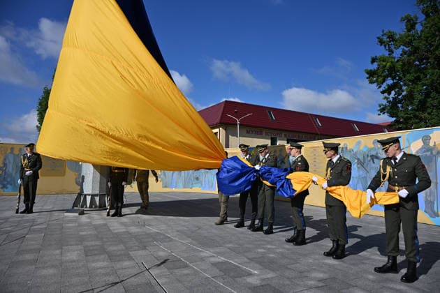 National Flag Day of Ukraine in Lviv LVIV, UKRAINE - AUGUST 23: Celebration of the National Flag Day of Ukraine during the Russian-Ukrainian War in Lviv, Ukraine on August 23, 2026. Due to the war, only the ceremonial raising of the Ukrainian flag on the highest flagpole in the city with the participation of soldiers from various branches of the armed forces took place. People also honored the fallen with a minute of silence, sang the Ukrainian anthem, and a military orchestra played several patriotic and folk songs. Michael Sorrow Anadolu Lviv Ukraine. Editorial use only. Please get in touch for any other usage.  Copyright: x2026xAnadoluxMichaelxSorrowx