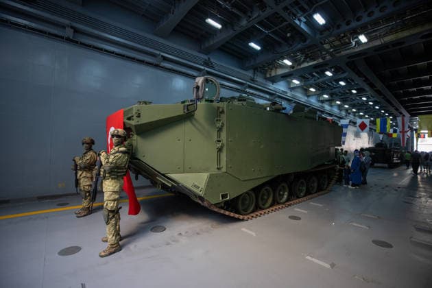 TEKNOFEST Blue Homeland KOCAELI, TURKIYE - AUGUST 23: Turkish soldiers stand guard beside a Turkish flag and an armored military vehicle displayed during TEKNOFEST Blue Homeland at the Golcuk Naval Shipyard Command in Kocaeli, Turkiye, on August 23, 2026. TCG Sancaktar carries out military missions including amphibious operations and mine-laying, and can also serve as a hospital, logistics support and evacuation ship in disaster zones. The event, organized under the leadership of the Turkish Ministry of National Defense and the Turkish Technology Team Foundation (T3 Foundation), with Anadolu serving as its Global Communication Partner, continues on its final day. Ibrahim Yozoglu Anadolu Kocaeli Turkey. Editorial use only. Please get in to  Copyright: x2026xAnadoluxIbrahimxYozoglux