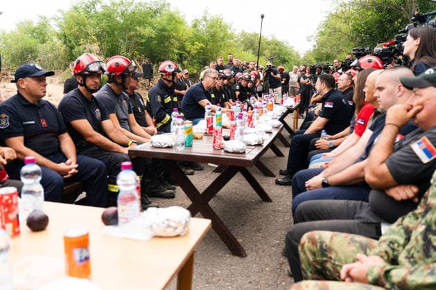 August 23, 2026, Umarak, Vojvodina, Serbia: 2026823, A umarak, Serbia -Serbian President VUCIC ALEKSANDAR visits the Deliblato Sands (Deliblatska Pescara) Special Nature Reserve to inspect the areas devastated by a massive wildfire. The president held an outdoor briefing and shared a meal with firefighters, military personnel, and rescue teams to discuss the ongoing response to the natural disaster. Umarak Serbia - ZUMAd223 20260823_zip_d223_008 Copyright: xMarkoxDimicx