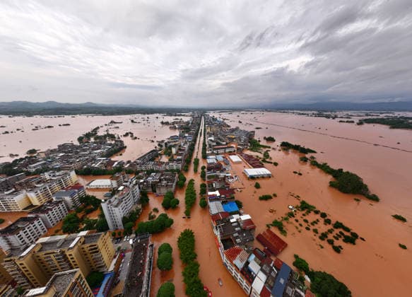 (260823) -- NINGMING, Aug. 23, 2026 -- An aerial drone photo taken on Aug. 23, 2026 shows a view of Ningming County, in south China s Guangxi Zhuang Autonomous Region. For days, Ningming County has been battered by typhoon-triggered heavy rainfall. Response forces have pooled their efforts to urgently evacuate stranded residents. ) CHINA-GUANGXI-TYPHOON-STRANDED RESIDENTS-TRANSFER (CN) ZhouxHua 