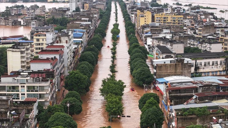 (260823) -- NINGMING, Aug. 23, 2026 -- An aerial drone photo taken on Aug. 23, 2026 shows a view of Ningming County, in south China s Guangxi Zhuang Autonomous Region. For days, Ningming County has been battered by typhoon-triggered heavy rainfall. Response forces have pooled their efforts to urgently evacuate stranded residents. ) CHINA-GUANGXI-TYPHOON-STRANDED RESIDENTS-TRANSFER (CN) ZhouxHua 