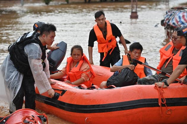 (260823) -- NINGMING, Aug. 23, 2026 -- Rescuers transfer stranded residents in Ningming County, south China s Guangxi Zhuang Autonomous Region, Aug. 23, 2026. For days, Ningming County has been battered by typhoon-triggered heavy rainfall. Response forces have pooled their efforts to urgently evacuate stranded residents. ) CHINA-GUANGXI-TYPHOON-STRANDED RESIDENTS-TRANSFER (CN) ZhouxHua 