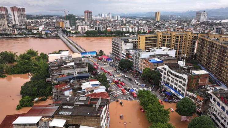 (260823) -- NINGMING, Aug. 23, 2026 -- An aerial drone photo taken on Aug. 23, 2026 shows rescuers transferring stranded residents in Ningming County, south China s Guangxi Zhuang Autonomous Region. For days, Ningming County has been battered by typhoon-triggered heavy rainfall. Response forces have pooled their efforts to urgently evacuate stranded residents. ) CHINA-GUANGXI-TYPHOON-STRANDED RESIDENTS-TRANSFER (CN) ZhouxHua 