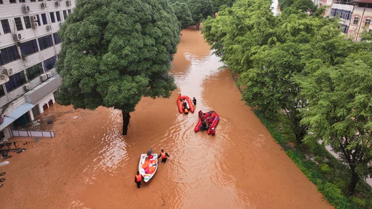 (260823) -- NINGMING, Aug. 23, 2026 -- An aerial drone photo taken on Aug. 23, 2026 shows rescuers transferring stranded residents in Ningming County, south China s Guangxi Zhuang Autonomous Region. For days, Ningming County has been battered by typhoon-triggered heavy rainfall. Response forces have pooled their efforts to urgently evacuate stranded residents. ) CHINA-GUANGXI-TYPHOON-STRANDED RESIDENTS-TRANSFER (CN) ZhouxHua 