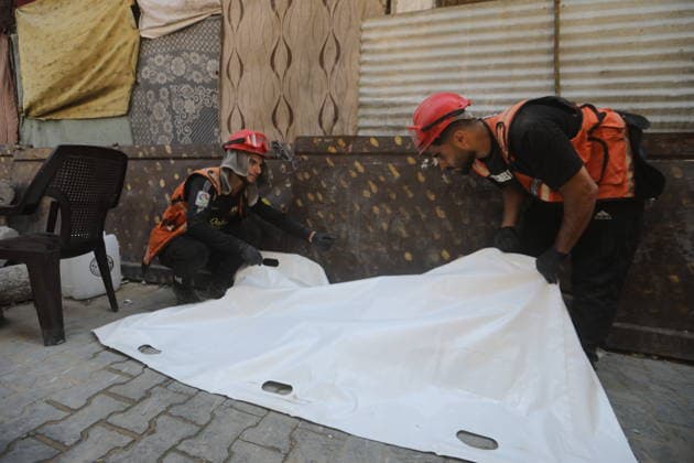 Civil Defense Recovers Bodies from Rubble in Gaza City Palestinian Civil Defense members work to recover bodies from beneath the rubble of the Abu Shamala family home in the Zeitoun neighborhood, east of Gaza City, on August 23, 2026, using a single excavator available to Civil Defense teams in the city. Limited access to equipment and heavy machinery is hampering search and recovery operations and delaying efforts to reach victims and missing people trapped under the rubble. Photo by Bilal Osama apaimages Gaza city Gaza Strip Palestinian Territory 230826_Gaza_BO_00(1).jpeg Copyright: xapaimagesxBilalxOsamax xapaimagesx
