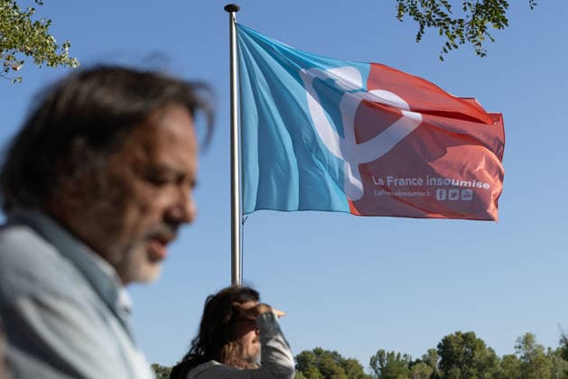 Jean Luc Melenchon Meeting during the LFI Amfis - Chateauneuf-sur-Isere People hold French and LFI flags as they attend LFI Jean Luc Melenchon meeting during the Amfis party Summer Conferences Universites d ete (Summer Gathering) of the LFI party in Chateauneuf-sur-Isere, southeastern France on August 23, 2026. Photo by Raphael Lafargue ABACAPRESS.COM Chateauneuf-sur-Isere France  Copyright: xLafarguexRaphael ABACAx
