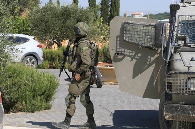 August 23, 2026, Nablus, West Bank, Palestine: Israeli military and police forces arrive at the Palestinian home for questioning after it was set on fire following an attack by a group of Jewish settlers in the village of Osarin, south of Nablus in the West Bank. The settlers attacked homes, torched a Palestinian car in the early morning hours, and wrote Hebrew slogans on the walls calling for revenge against Palestinians. Nablus Palestine  - ZUMAs197 20260823_aaa_s197_031 Copyright: xNasserxishatyehx