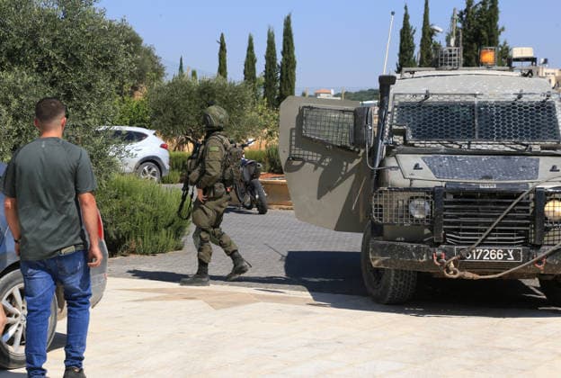 August 23, 2026, Nablus, West Bank, Palestine: Israeli military and police forces arrive at the Palestinian home for questioning after it was set on fire following an attack by a group of Jewish settlers in the village of Osarin, south of Nablus in the West Bank. The settlers attacked homes, torched a Palestinian car in the early morning hours, and wrote Hebrew slogans on the walls calling for revenge against Palestinians. Nablus Palestine  - ZUMAs197 20260823_aaa_s197_034 Copyright: xNasserxishatyehx