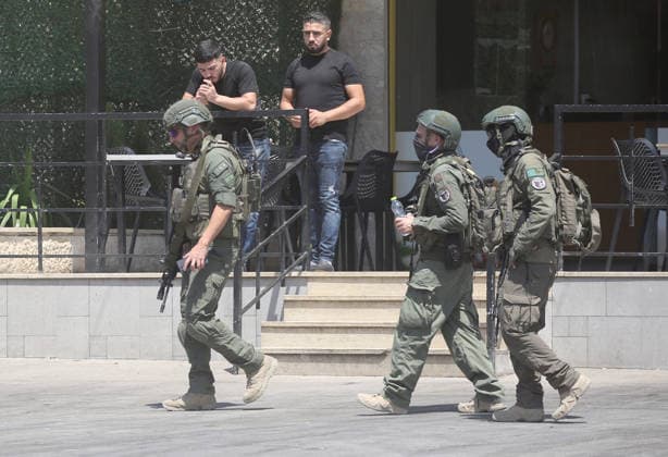 Palestinian-Israeli conflict in Nablus, Palestine - 23 Aug 2026 Israeli soldiers pass in front of a Palestinian shop during a military operation in the Askar refugee camp. Ajouri was killed during an Israeli military operation in the Askar refugee camp. Israeli forces raided Palestinian shops and homes. A Palestinian medical source reported that a 15-year-old boy was killed by Israeli fire and two others were wounded during stone-throwing clashes in the Askar refugee camp. Nablus Palestine Copyright: xNasserxishatyehx xSOPAxImagesx Nishtayeh176