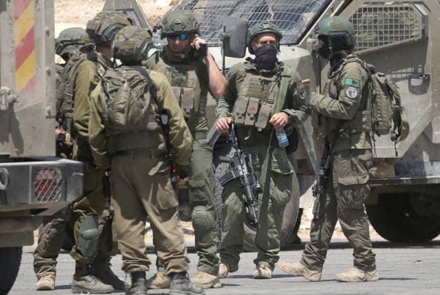 Palestinian-Israeli conflict in Nablus, Palestine - 23 Aug 2026 Israeli soldiers seen gathered during a military operation in the Askar refugee camp. Ajouri was killed during an Israeli military operation in the Askar refugee camp. Israeli forces raided Palestinian shops and homes. A Palestinian medical source reported that a 15-year-old boy was killed by Israeli fire and two others were wounded during stone-throwing clashes in the Askar refugee camp. Nablus Palestine Copyright: xNasserxishatyehx xSOPAxImagesx Nishtayeh170