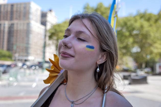 August 23, 2026, New York, New York, USA: Painted face flag at the Annual Ukrainian Independence March celebrating freedom from foreign domination. A large crowd .marched from Foley Square down Broadway to Bowling Green in Lower Manhattan commemorating .Ukraine freedom from Soviet Union oppression on Aujust 24. Carrying the blue and yellow flag of Ukraine as well as the US flag they carried the message of fighting back against Russia trying to continue their colonial empire. Ukraine is standing strong..Standing for democracy not tyranny. New York USA  - ZUMAh156 20260823_znp_h156_002 Copyright: xMiloxHessx
