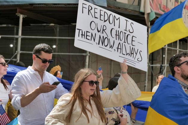 August 23, 2026, New York, New York, USA: Annual Ukrainian Independence March celebrating freedom from foreign domination. A large crowd .marched from Foley Square down Broadway to Bowling Green in Lower Manhattan commemorating .Ukraine freedom from Soviet Union oppression on Aujust 24. Carrying the blue and yellow flag of Ukraine as well as the US flag they carried the message of fighting back against Russia trying to continue their colonial empire. Ukraine is standing strong..Standing for democracy not tyranny. New York USA  - ZUMAh156 20260823_znp_h156_007 Copyright: xMiloxHessx