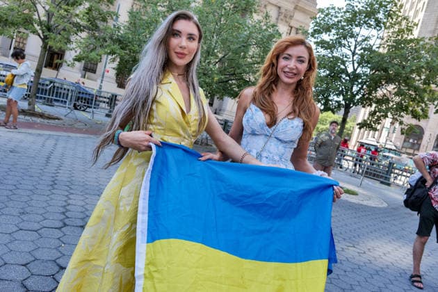 August 23, 2026, New York, New York, USA: Showing the flag at the Annual Ukrainian Independence March celebrating freedom from foreign domination. A large crowd .marched from Foley Square down Broadway to Bowling Green in Lower Manhattan commemorating .Ukraine freedom from Soviet Union oppression on Aujust 24. Carrying the blue and yellow flag of Ukraine as well as the US flag they carried the message of fighting back against Russia trying to continue their colonial empire. Ukraine is standing strong..Standing for democracy not tyranny. New York USA  - ZUMAh156 20260823_znp_h156_008 Copyright: xMiloxHessx