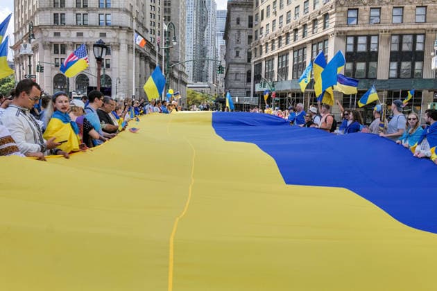 August 23, 2026, New York, New York, USA: Giant Ukraine flag at the Annual Ukrainian Independence March celebrating freedom from foreign domination. A large crowd .marched from Foley Square down Broadway to Bowling Green in Lower Manhattan commemorating .Ukraine freedom from Soviet Union oppression on Aujust 24. Carrying the blue and yellow flag of Ukraine as well as the US flag they carried the message of fighting back against Russia trying to continue their colonial empire. Ukraine is standing strong..Standing for democracy not tyranny. New York USA  - ZUMAh156 20260823_znp_h156_010 Copyright: xMiloxHessx