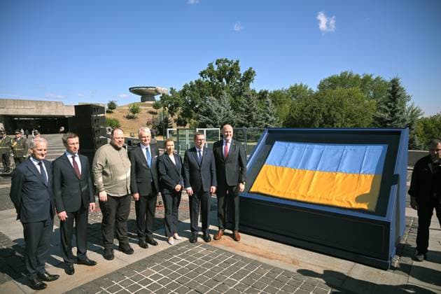 Prime Minister of Norway Jonas Gahr Store, Prime Minister of Ukraine Sergii Koretskyi, Speaker of the Ukrainian Parliament Ruslan Stefanchuk, President of Lithuania Gitanas Nauseda, Prime Minister of Denmark Mette Frederiksen, Prime Minister of Estonia Kristen Michal and Prime Minister of Latvia Andris Kulbergs (L to R) pose for a photo by the historical flag of Ukraine, known as the Independence Flag, which was brought into the session hall of the Ukrainian Parliament in the first moments after the declaration of independence of Ukraine on August 24, 1991, during the ceremony to raise the State Flag at the National Museum of the History of Ukraine in the Second World War Memorial Complex on National Flag Day, Kyiv, Ukraine, August 23, 2026  Copyright: xYevhenxKotenkox