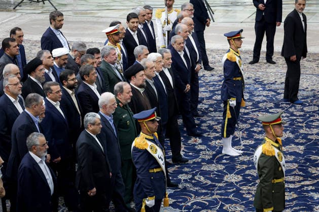 President Masoud Pezeshkian (C) attends an event to mark the first day of the Government Week at the mausoleum of Ayatollah Ruhollah Khomeini, the founder of the Islamic Republic of Iran, in Tehran, Iran on August 23, 2026. Iranian President Masoud Pezeshkian declared that no power will be able to force the Iranian people into surrender. He dismissed claims that sanctions would turn Iran into another Venezuela, saying that has not happened. He stressed the need to begin conserving gasoline consumption through government measures, including a plan to reduce the number and fuel use of government vehicles.  IRN2026082313 IranianxPresidency