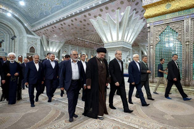 President Masoud Pezeshkian (C-R) attends an event to mark the first day of the Government Week at the mausoleum of Ayatollah Ruhollah Khomeini, the founder of the Islamic Republic of Iran, in Tehran, Iran on August 23, 2026. Iranian President Masoud Pezeshkian declared that no power will be able to force the Iranian people into surrender. He dismissed claims that sanctions would turn Iran into another Venezuela, saying that has not happened. He stressed the need to begin conserving gasoline consumption through government measures, including a plan to reduce the number and fuel use of government vehicles.  IRN2026082321 IranianxPresidency