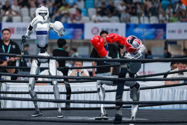 BEIJING, CHINA - AUGUST 23: Robots compete in the Kickboxing event on day 2 of the 2nd World Humanoid Robot Games at National Speed Skating Oval on August 23, 2026 in Beijing, China.  Copyright: xVCGx 111661664151