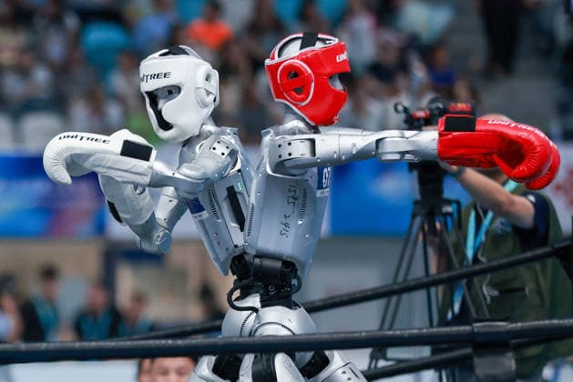 BEIJING, CHINA - AUGUST 23: Robots compete in the Kickboxing event on day 2 of the 2nd World Humanoid Robot Games at National Speed Skating Oval on August 23, 2026 in Beijing, China.  Copyright: xVCGx 111661664146